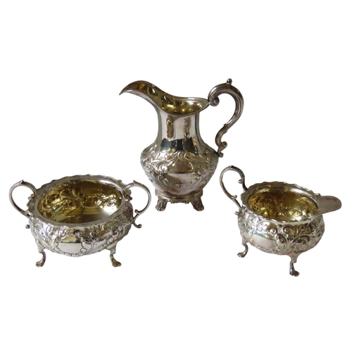 689 - A WILLIAM IV SILVER CREAMER AND A SILVER SUGAR WITH MATCHING JUG, the creamer with scroll foliate re... 