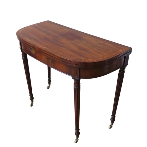 1 - A MAHOGANY AND CROSSBANDED CARD TABLE, IN THE MANNER OF GILLOWS, the fold-over top with a baize line... 