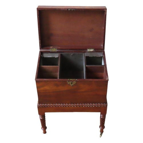 67 - A GEORGE IV MAHOGANY CELLARETTE ON STAND, CIRCA 1825, rectangular form flanked by twin lion's head r... 