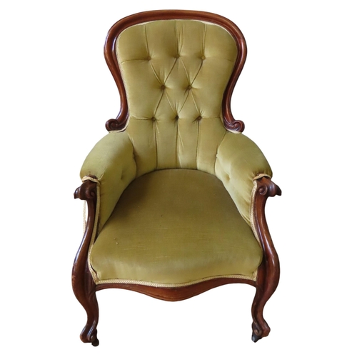 62 - A VICTORIAN MAHOGANY SPOON BACK ARMCHAIR, with elegant scrolling arms, the buttoned back panel and s... 