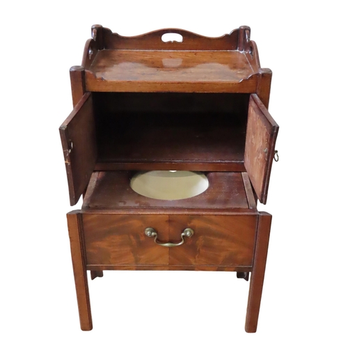 52 - A  GEORGE III MAHOGANY COMMODE, three quarter galleried top over twin cupboard doors, with pull out ... 