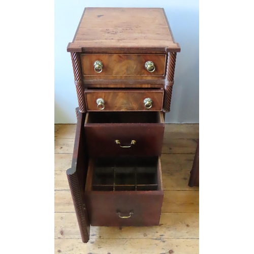 22 - A GEORGE IV MAHOGANY SIDEBOARD, constructed in three sections, comprised of a pair of rope twist pil... 