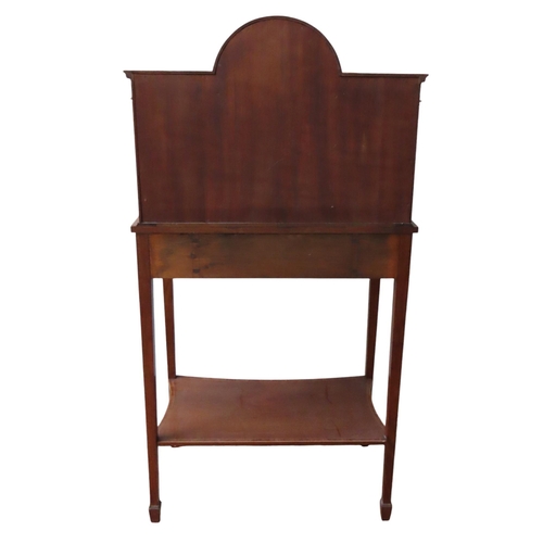 24 - AN EDWARDIAN MAHOGANY AND CROSS BANDED BONHEUR DU JOUR, the break arch central recess over a bow fro... 