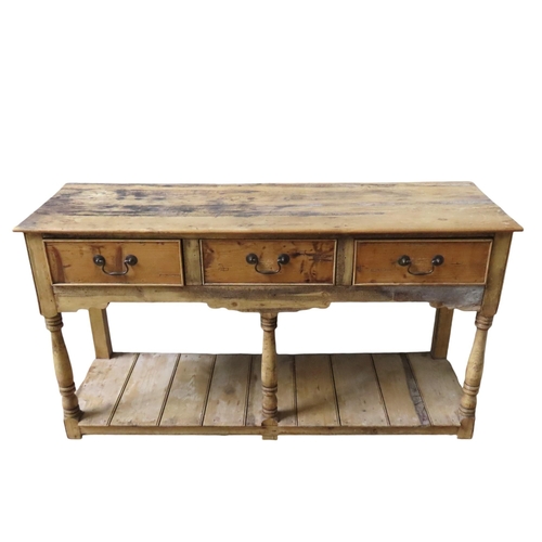 68 - A COUNTRY PINE DRESSER BASE, 19TH CENTURY, rectangular top with three frieze drawers over a fret cut... 