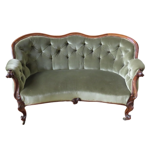 91 - A VICTORIAN MAHOGANY FRAMED SETTEE, serpentine top rail over a button upholstered back panel with sc... 