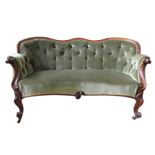 91 - A VICTORIAN MAHOGANY FRAMED SETTEE, serpentine top rail over a button upholstered back panel with sc... 