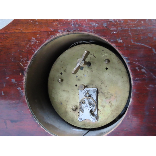 175 - AN EDWARDIAN MAHOGANY BRACKET CLOCK, in a break arch case, the 80 mm enamel dial flanked by scrollin... 