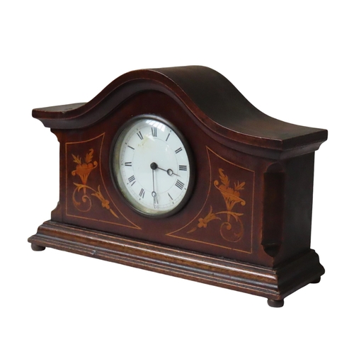 175 - AN EDWARDIAN MAHOGANY BRACKET CLOCK, in a break arch case, the 80 mm enamel dial flanked by scrollin... 