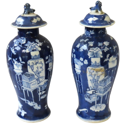 350 - A PAIR OF CHINESE BLUE AND WHITE BALUSTER VASES, LATE QING DYNASTY, 19TH CENTURY, the domed covers s... 