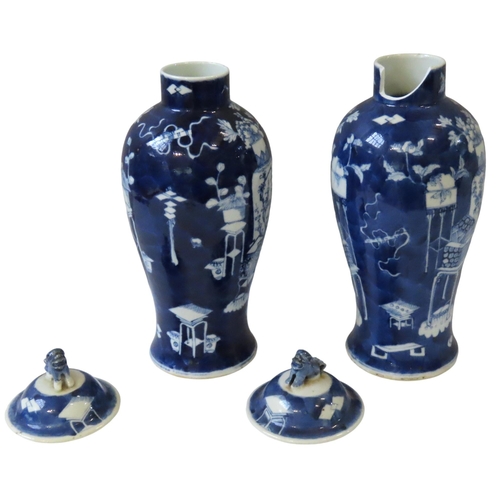 350 - A PAIR OF CHINESE BLUE AND WHITE BALUSTER VASES, LATE QING DYNASTY, 19TH CENTURY, the domed covers s... 