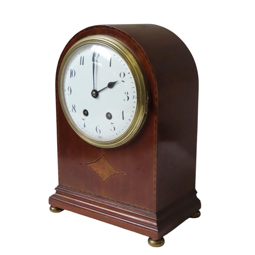 177 - AN EDWARDIAN MAHOGANY BRACKET CLOCK, 160 mm enamelled dial with a French movement in an arched case ... 