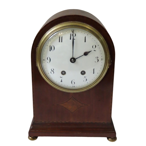 177 - AN EDWARDIAN MAHOGANY BRACKET CLOCK, 160 mm enamelled dial with a French movement in an arched case ... 