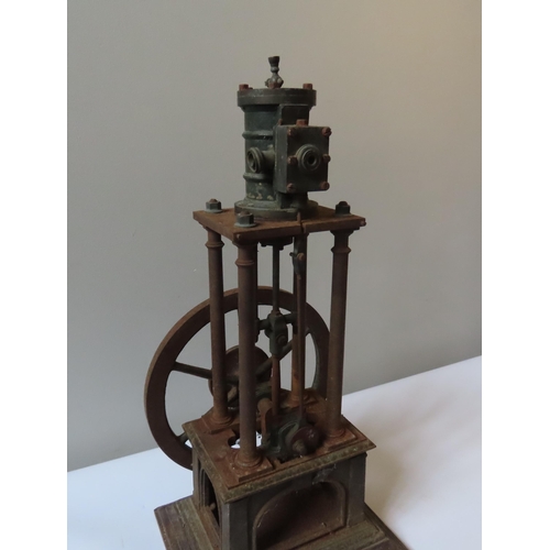 248 - AN ENGINEERED FOUR COLUMN VERTICAL STEAM ENGINE the top-mounted cylinder over four columns with larg... 