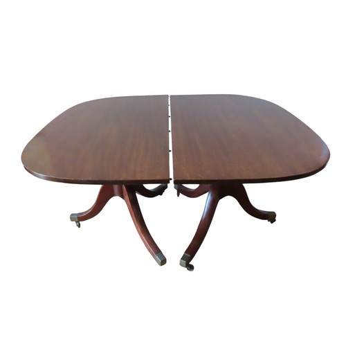 94 - A GEORGE III MAHOGANY TWIN PEDESTAL DINING TABLE, with extra leaf insertion, the rectangular top rai... 