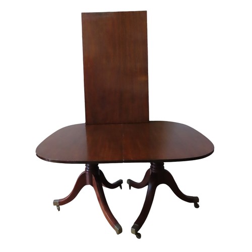 94 - A GEORGE III MAHOGANY TWIN PEDESTAL DINING TABLE, with extra leaf insertion, the rectangular top rai... 