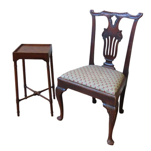 23 - A GEORGE II OAK SIDE CHAIR, scrolling carved top rail over a pierced splat, the drop-in seat raised ... 