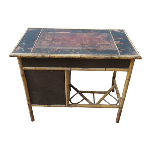 111 - A 19TH CENTURY BAMBOO AND BLACK LACQUER DESK, the rectangular top with a leather inset writing surfa... 