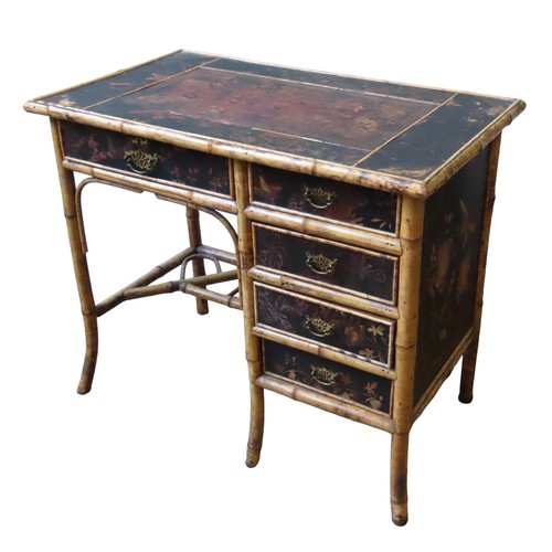 111 - A 19TH CENTURY BAMBOO AND BLACK LACQUER DESK, the rectangular top with a leather inset writing surfa... 