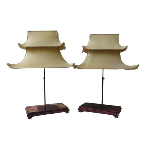 192 - A PAIR OF VINTAGE TABLE LAMP STANDS, the elegant silk covered two tier pagoda style shades raised on... 