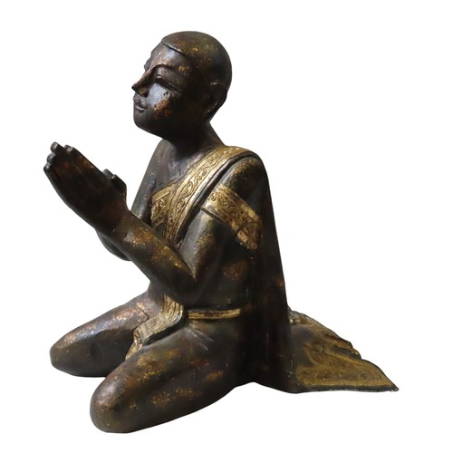 222 - BURMESE GILDED WOODEN KNEELING FIGURE of a praying monk draped in a gilded sash with tube lined deco... 