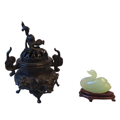 299 - A MINIATURE BRONZE JAPANESE KORO, the pierced dome cover surmounted by a foo dog (13 cm high)togethe... 