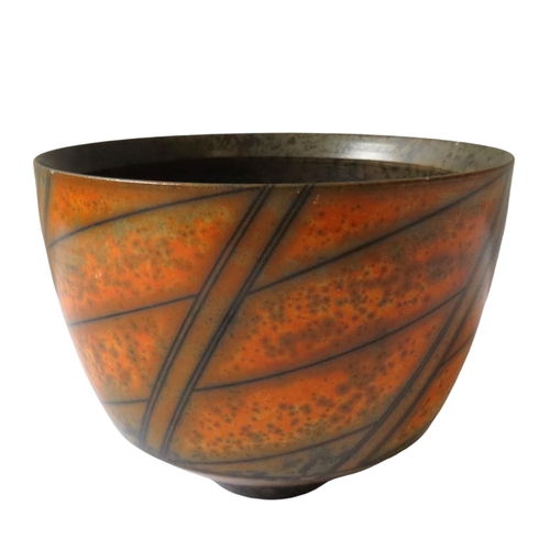 A DUNCAN ROSS TERRA SIGILATTA STYLE EARTHENWARE BOWL, attractive mottled burnt orange finish with linear design, raised on a tapering foot, with incised artist's mark to the underside