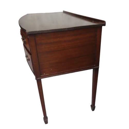 37 - A LATE 19TH CENTURY MAHOGANY WRITING DESK, bow front form, with a long frieze drawer flanked by four... 