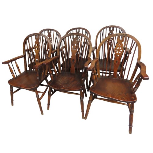 54 - SIX SPINDLEBACK WINDSOR CHAIRS with elm seat and beech legs. Four of the chairs have 'NAAFI Corporat... 