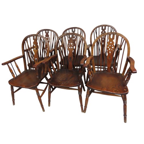 54 - SIX SPINDLEBACK WINDSOR CHAIRS with elm seat and beech legs. Four of the chairs have 'NAAFI Corporat... 