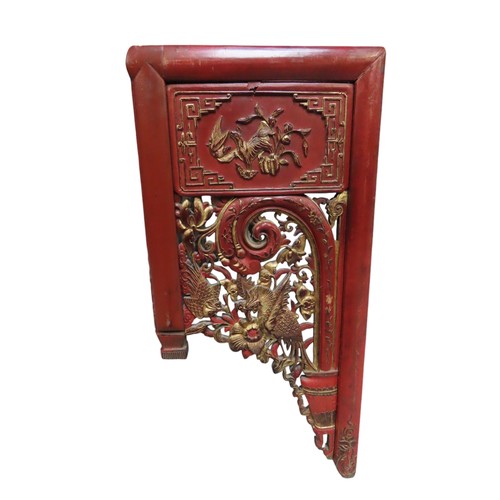 109 - ASIAN RED LACQUER PELMET/SHELF, the pierced frieze panels decorated with gilded scenes of temples an... 