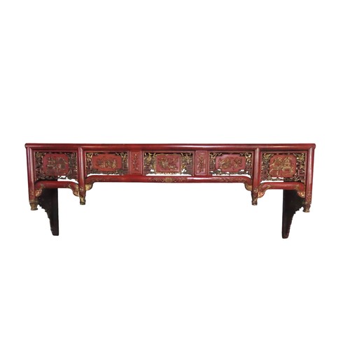 109 - ASIAN RED LACQUER PELMET/SHELF, the pierced frieze panels decorated with gilded scenes of temples an... 