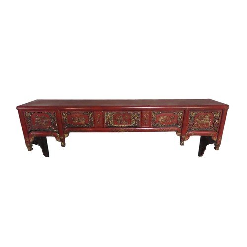 109 - ASIAN RED LACQUER PELMET/SHELF, the pierced frieze panels decorated with gilded scenes of temples an... 