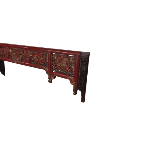 109 - ASIAN RED LACQUER PELMET/SHELF, the pierced frieze panels decorated with gilded scenes of temples an... 