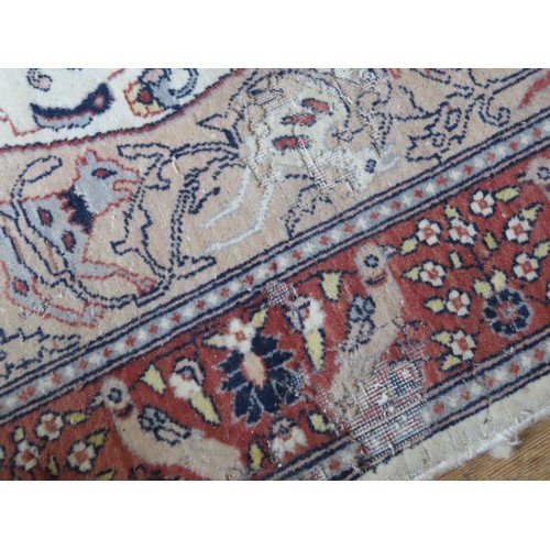 147 - TWO WOOL RUGS consisting of one with a cafe au lait border and cream ground centre, with damage (156... 