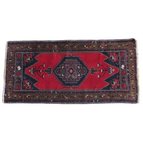 153 - NAVY AND BROWN BORDERED WOOL RUG AND SMALLER RED WOOL RUG Navy and brown deep bordered rug with cent... 