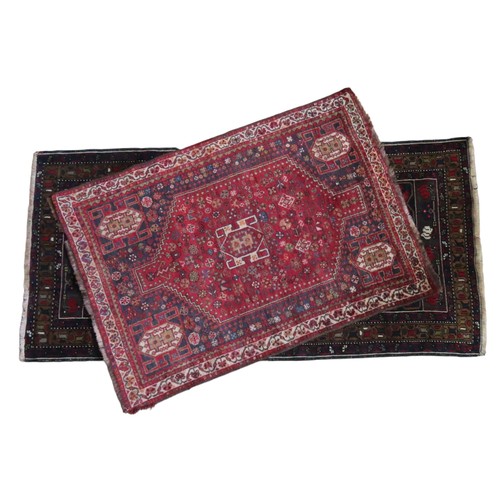 153 - NAVY AND BROWN BORDERED WOOL RUG AND SMALLER RED WOOL RUG Navy and brown deep bordered rug with cent... 