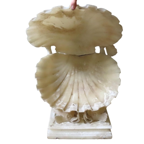 593 - A CARVED ALABASTER NEO-CLASSICAL STYLE FOUNTAIN, modelled as a open clam shell supported by opposing... 