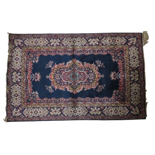 149 - EASTERN BORDERED WOOL RUG AND SMALLER GREEN INDIAN WOOL RUGEastern bordered wool rug on navy blue gr... 