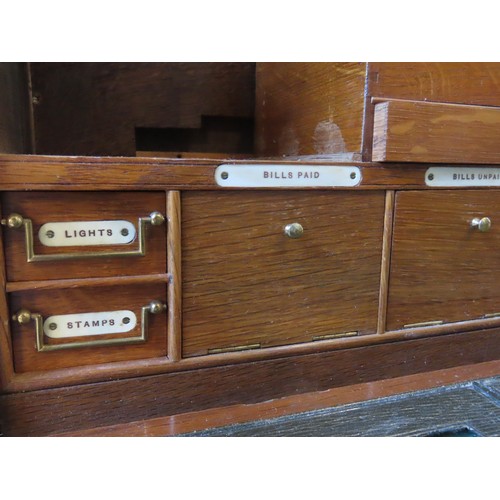 214 - AN EDWARDIAN OAK CAMPAIGN STYLE CLERK'S BOX, bearing a presentation plaque to the top and brass inse... 