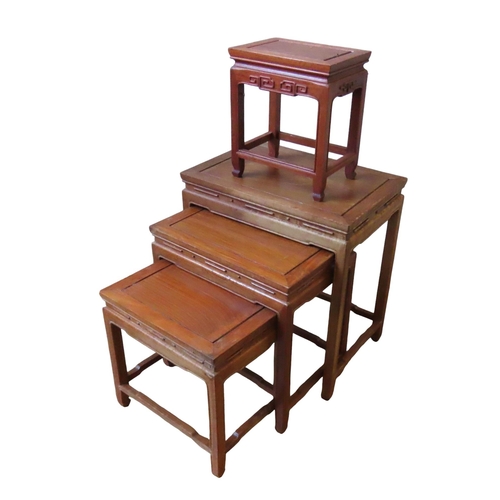 102 - A NEST OF THREE CHINESE HARDWOOD TABLES, 20TH CENTURY, the panel inset rectangular tops over moulded... 