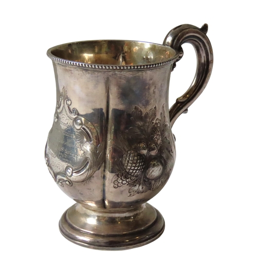 686 - A VICTORIAN SILVER PRESENTATION MUG, lobed melon form with elegant scroll handle, beaded edge rim an... 