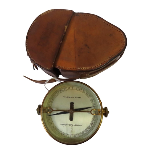 260 - A GALVANOMETER BY TELEGRAPH WORKS, SILVERTOWN, LONDON, in a brass case with two terminals and leathe... 