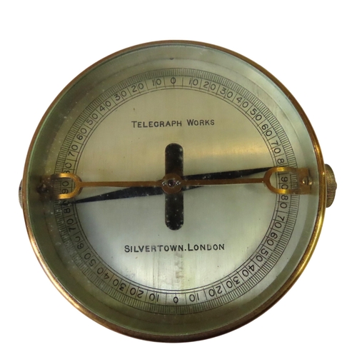 260 - A GALVANOMETER BY TELEGRAPH WORKS, SILVERTOWN, LONDON, in a brass case with two terminals and leathe... 