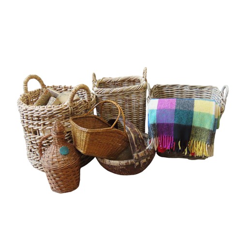 83 - A COLLECTION OF BASKETS consisting of three log baskets, two smaller baskets and a European wicker c... 