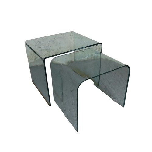 77 - TWO CONTEMPORARY GLASS FORMED GRADUATED NESTING TABLESLargest 61cm wide x 51cm high x 50cm depthSmal... 