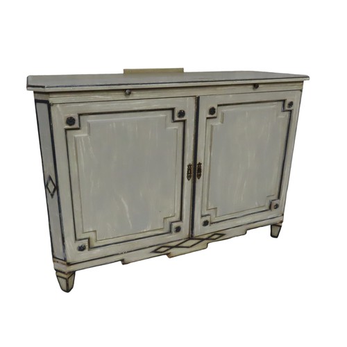 34 - A FRENCH TWO DOOR SIDE CUPBOARD, rectangular top with canted corners over a brushing slide, the twin... 