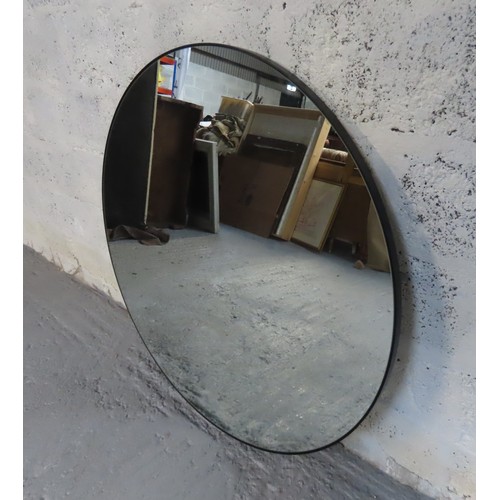 204 - A LARGE CONTEMPORARY CIRCULAR WALL MIRROR, the plate mounted in a black steel frame with fixing wall... 