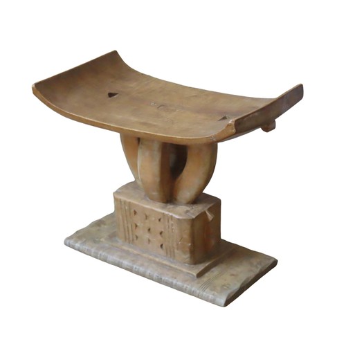 219 - A CARVED ASHANTI STOOL, the bowed rectangular seat on four curved pillars, raised on a chip carved r... 