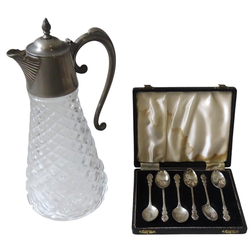 626 - A SET OF SIX VINTAGE SILVER TEASPOONS AND A CLARET JUG, the spoon handles with chased scroll decorat... 