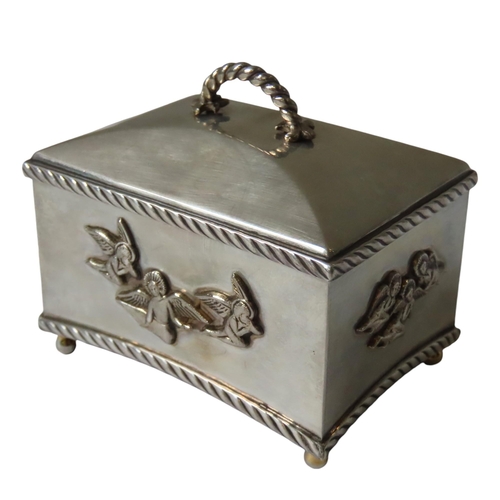 627 - A SILVER CASED CHRISTENING MUSIC BOX, by the St James House Company, rectangular form with applied p... 